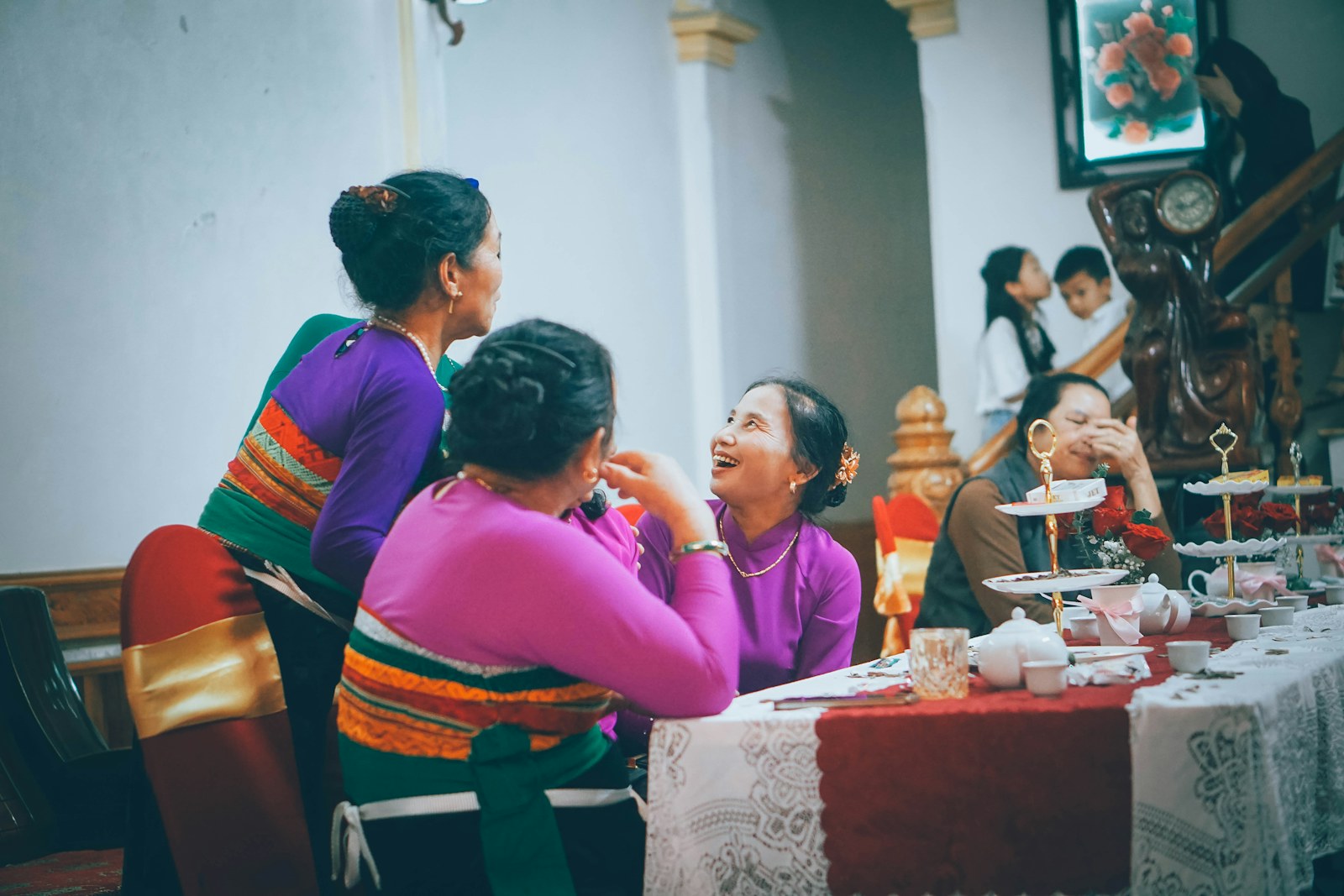 Placeholder photo of women sharing conversation around a table at home